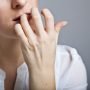 Woman in depression on gray background